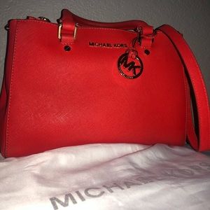 Red Medium Michael Kors purse.